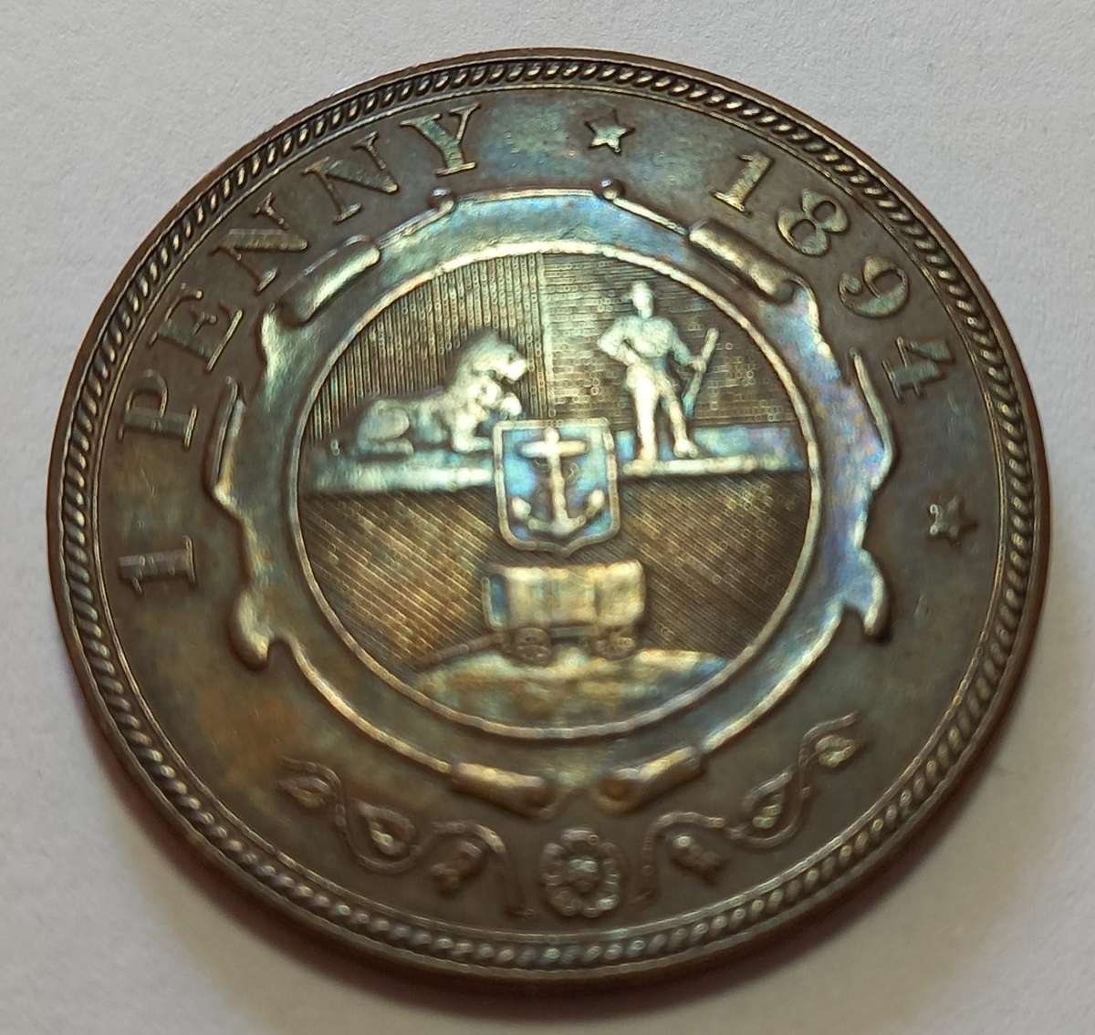 ZAR 1894,  1 Penny,  AUC ? Rainbow coloring, excellent coin.