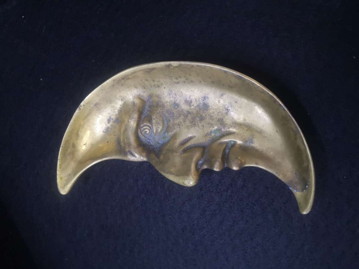 Brass crescent moon face