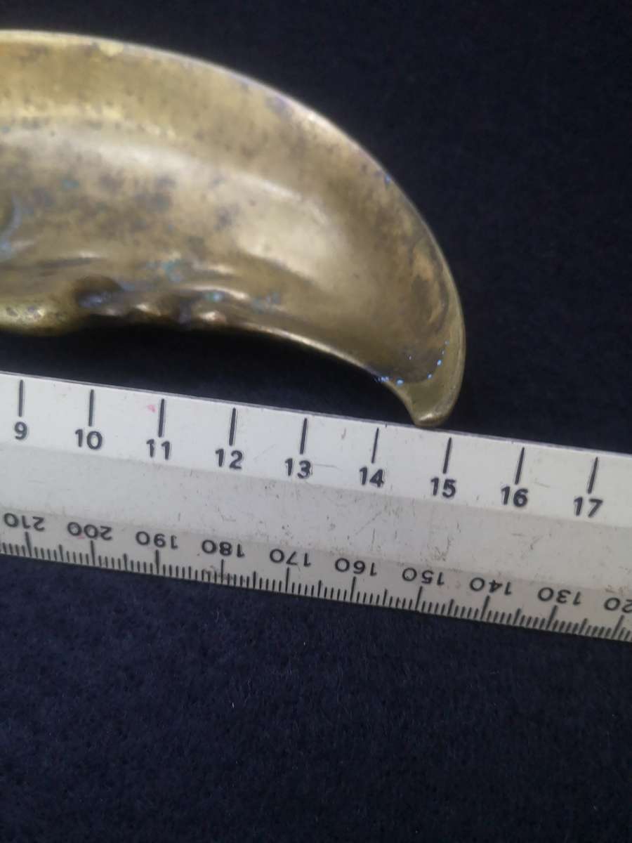 Brass crescent moon face