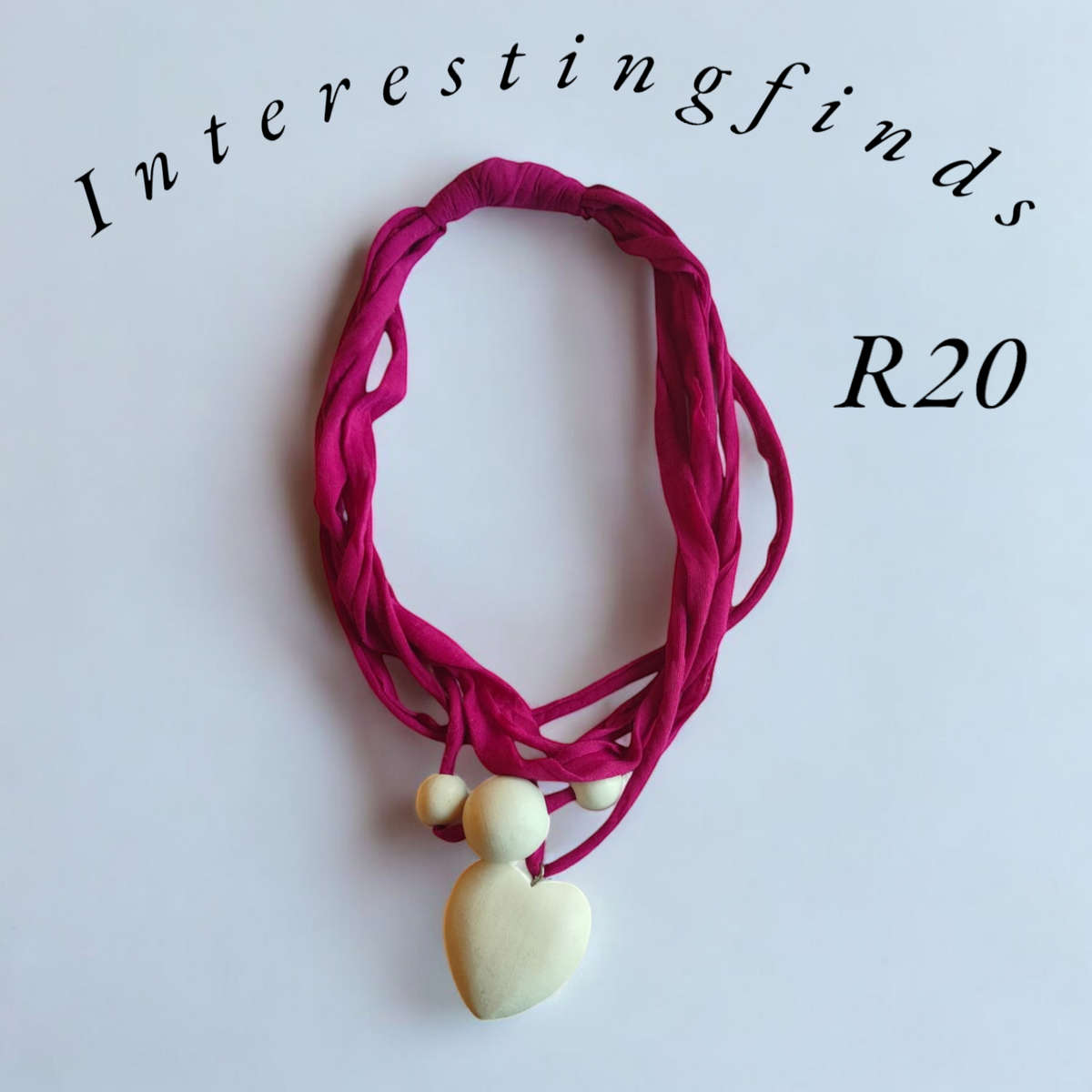Beautiful pink fabric necklace with wooden heart pendant