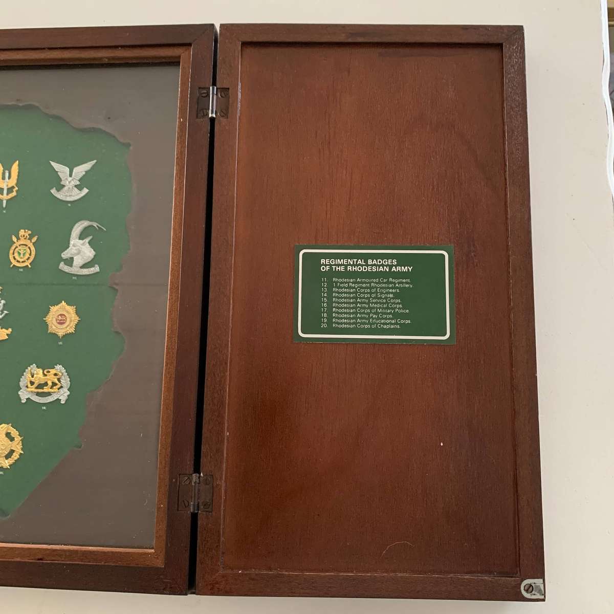 Display Cabinet of 'Rhodesian' Regimental Badges (Ltd Number)