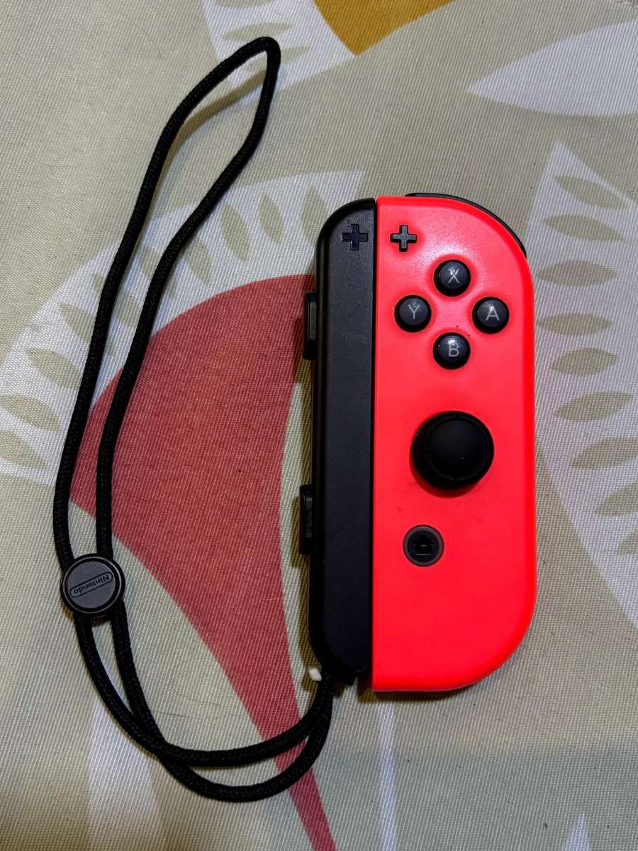 neon red right Joy-Con controller for Nintendo Switch with strap