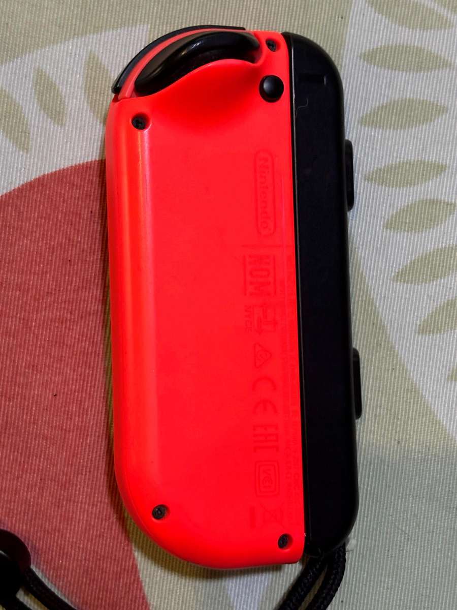 neon red right Joy-Con controller for Nintendo Switch with strap