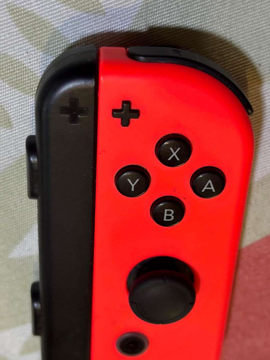 neon red right Joy-Con controller for Nintendo Switch with strap