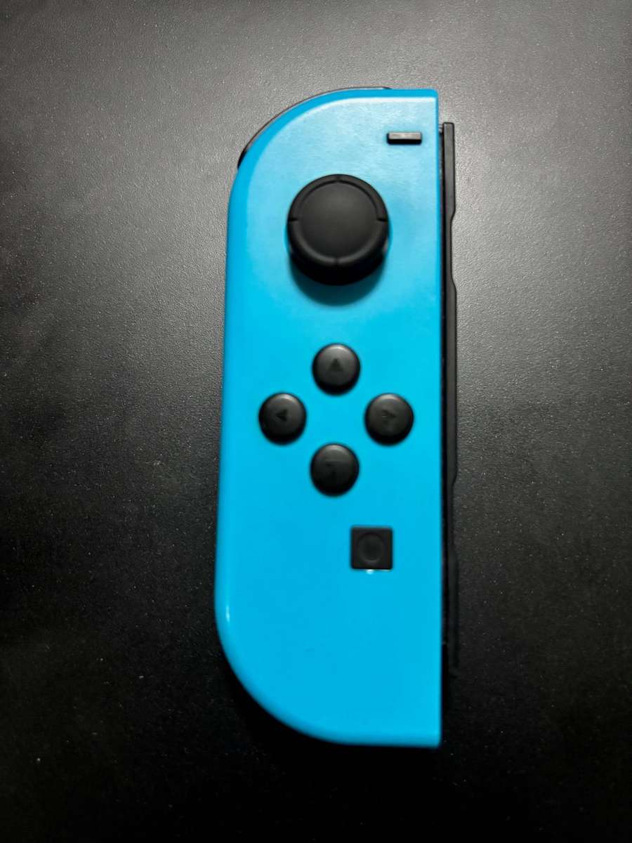 neon blue Left Joy-Con controller for Nintendo Switch with strap