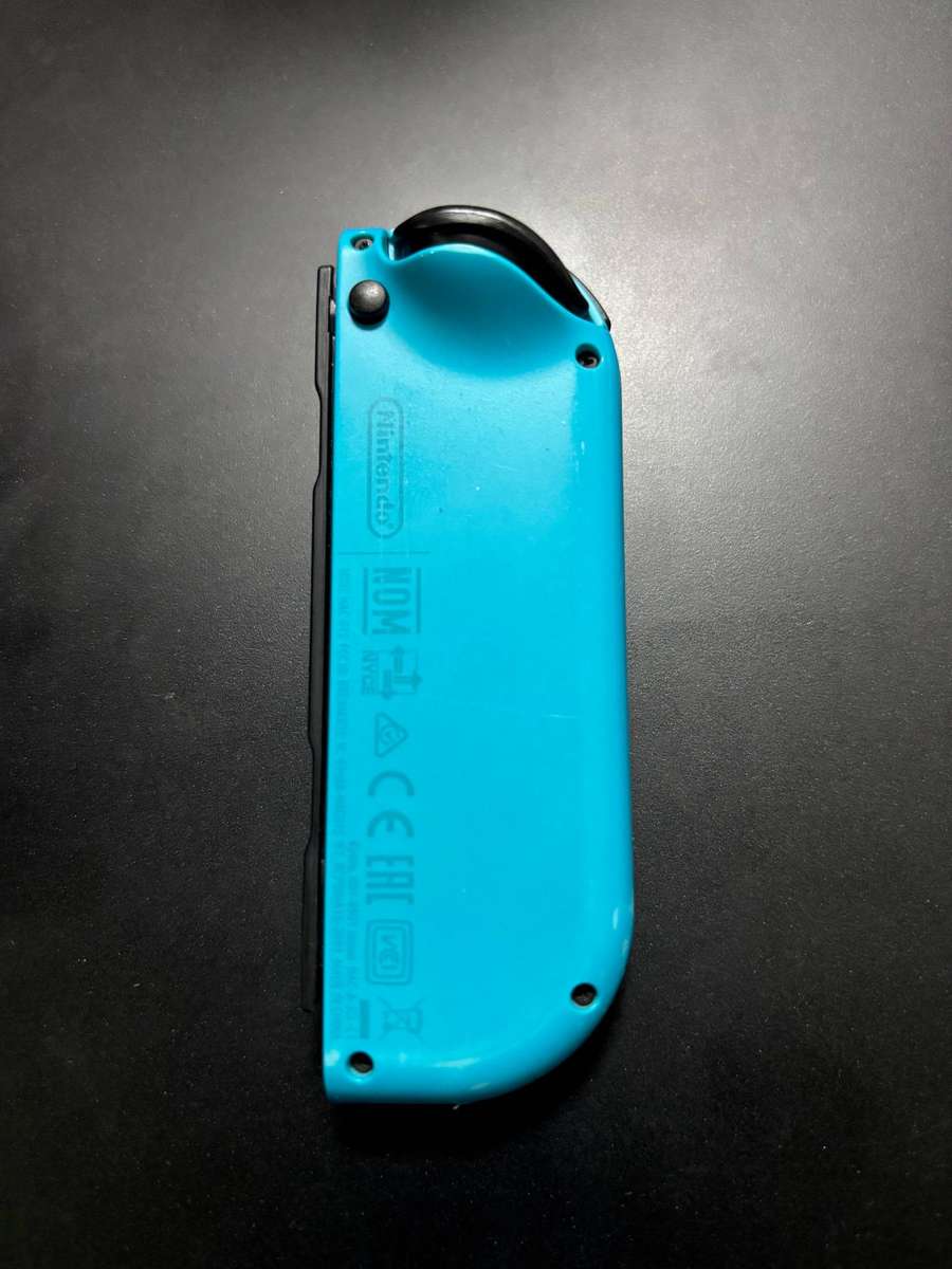 neon blue Left Joy-Con controller for Nintendo Switch with strap