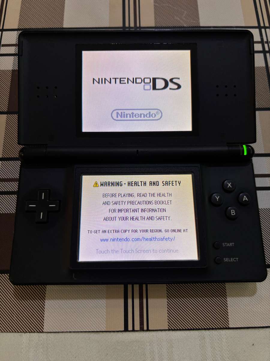 black Nintendo DS Lite with charger, stylus & free game