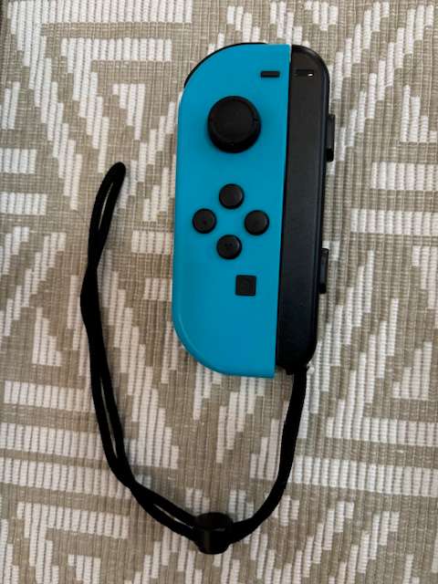 neon blue Left Joy-Con controller for Nintendo Switch with strap
