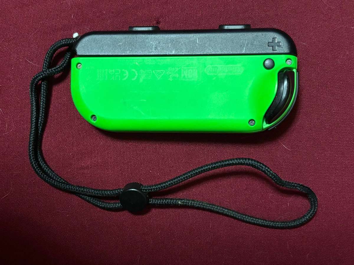 neon green Left Joy-Con controller for Nintendo Switch with strap