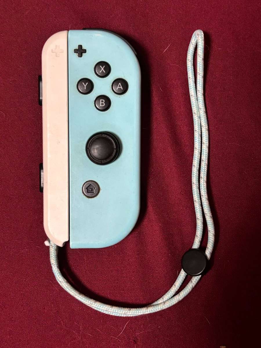pastel blue Right Joy-Con controller for Nintendo Switch with strap