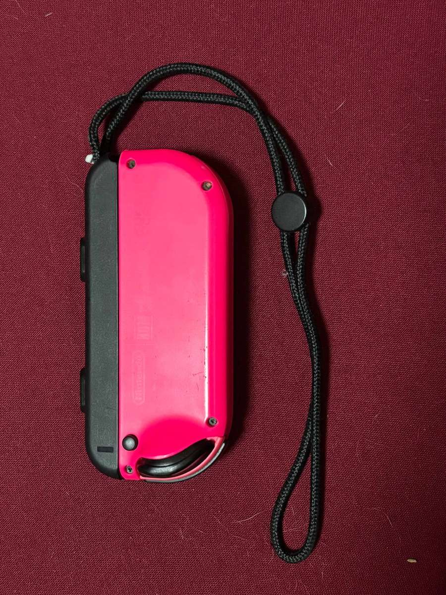 neon pink Right Joy-Con controller for Nintendo Switch with strap