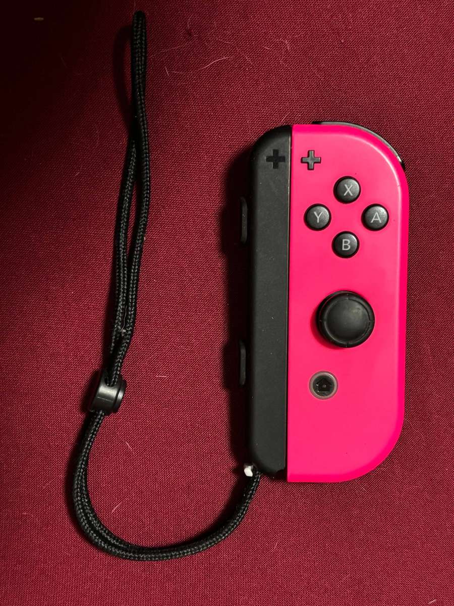 neon pink Right Joy-Con controller for Nintendo Switch with strap