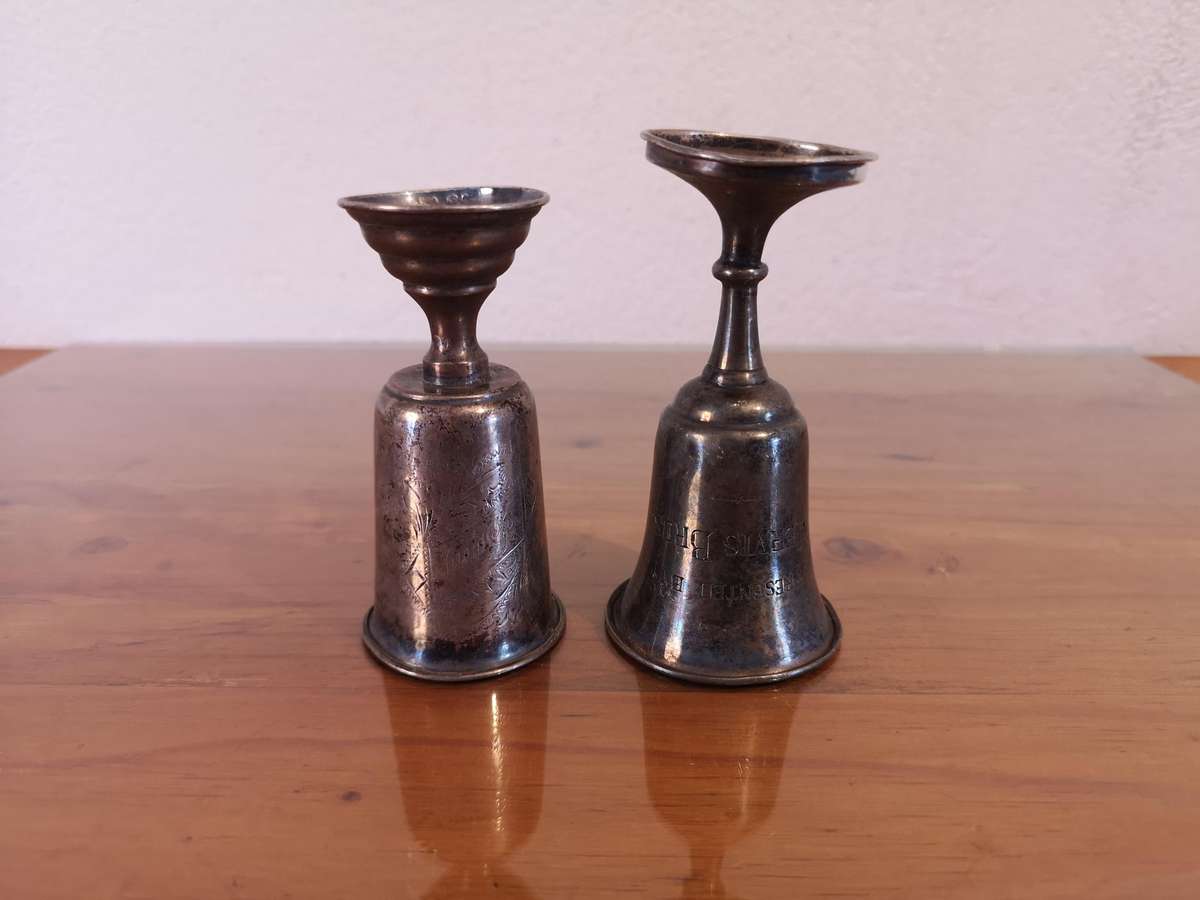 Two small old hallmarked sterling silver trophies