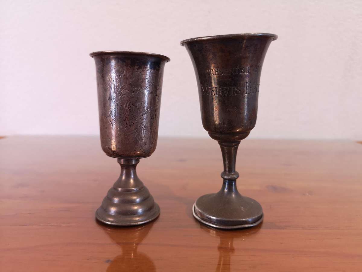 Two small old hallmarked sterling silver trophies