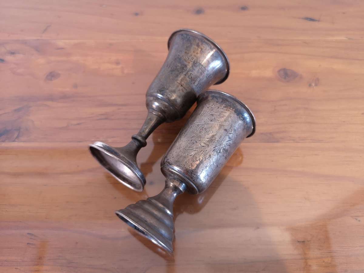 Two small old hallmarked sterling silver trophies