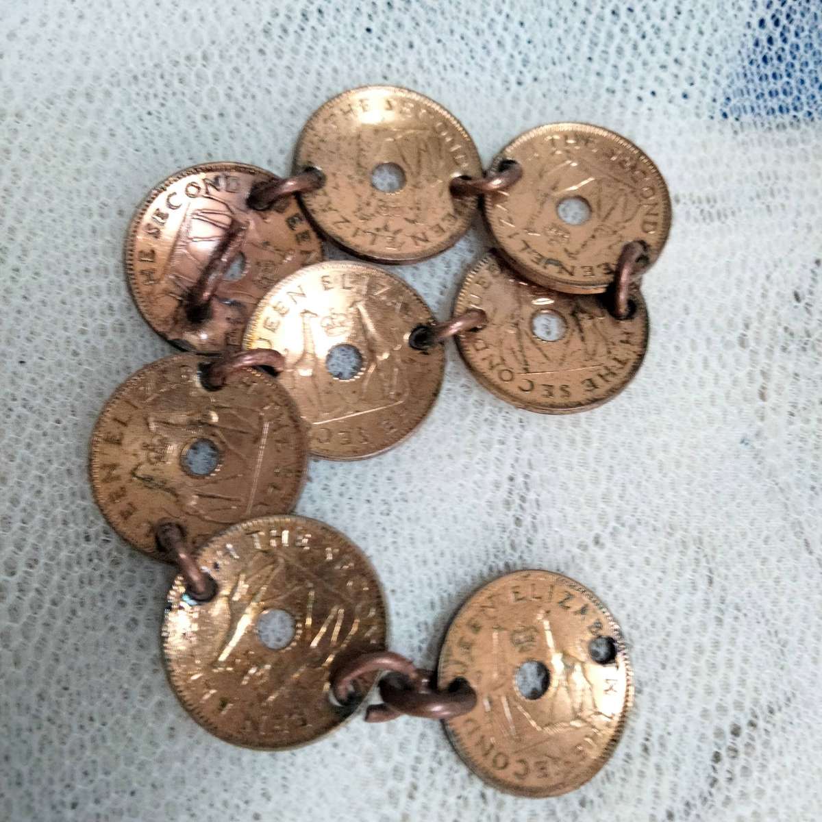 bracelet- Coins Rhodesia+Nyasaland half penny  link rings into holes LOOK At My BUY NOW NO WAITING