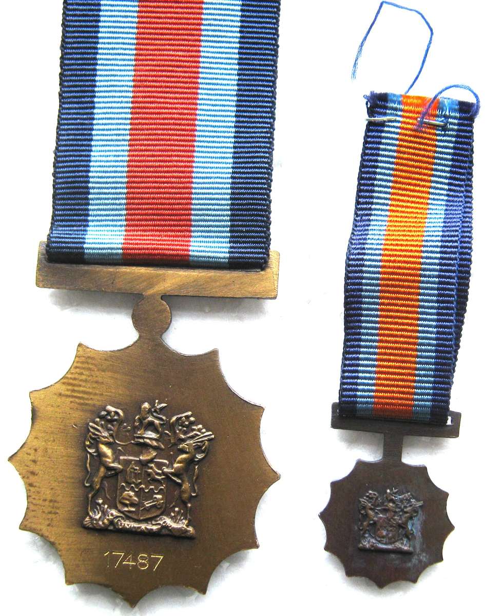 MILITARY MERIT MEDAL WITH MINIATURE NUMBERED 17487 IN VERY GOOD CONDITION