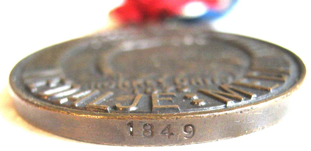 FULL SIZE JOHN CHARD MEDAL WITH VOIDED ACORN AND FOR ARMY SERVICE NUMBERED 1849 IN GOOD CONDITION