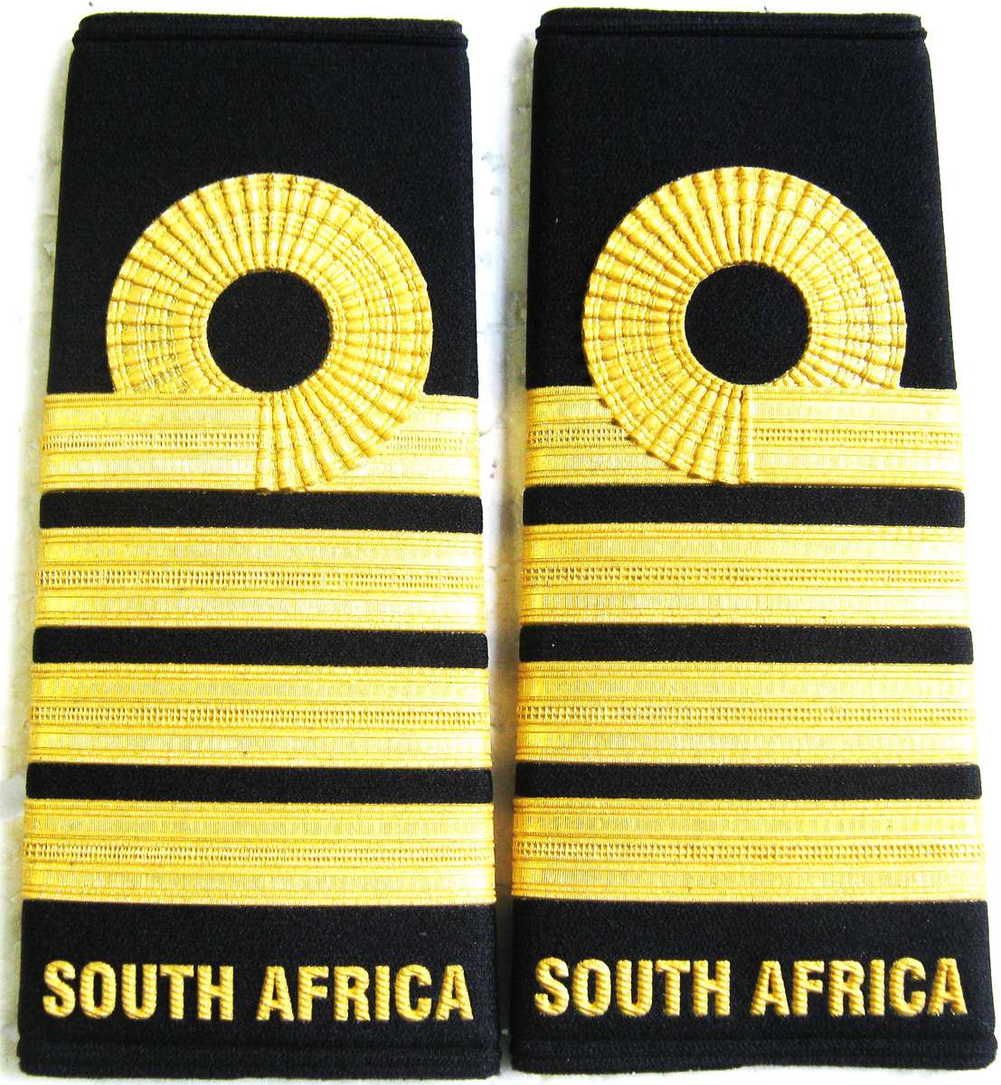 NEW NAVY PAIR OF CAPTAINS PLASTICISED SHOULDER STRAPS IN UNUSED CONDITION