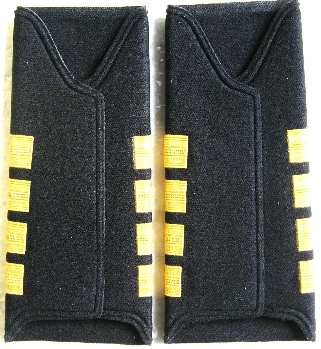 NEW NAVY PAIR OF CAPTAINS PLASTICISED SHOULDER STRAPS IN UNUSED CONDITION