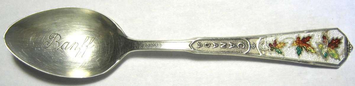 STERLING SILVER AND ENAMEL COLLECTABLE CANADA TEA SPOON 6 GMS WITH "BANFF" ENGRAVED  9.5 CM