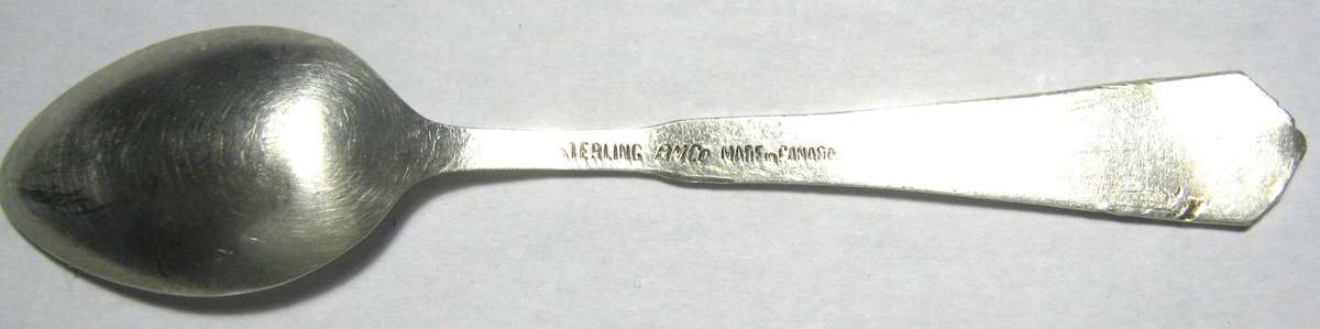 STERLING SILVER AND ENAMEL COLLECTABLE CANADA TEA SPOON 6 GMS WITH "BANFF" ENGRAVED  9.5 CM
