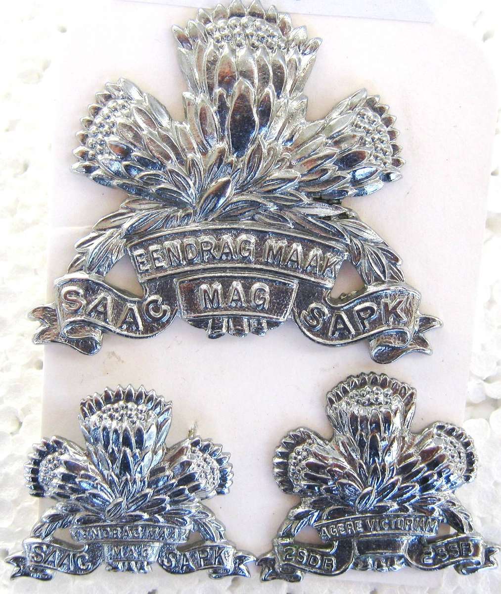 S.A. ARMOURED CORPS CHROME CAP AND COLLAR BADGES WORN 1976 - 1996 IN GOOD CONDITION