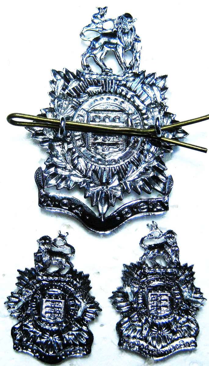 SADF ARMY SERVICES CORPS CAP AND COLLAR BADGES WITH LUGS AND PINS IN GOOD CONDITION