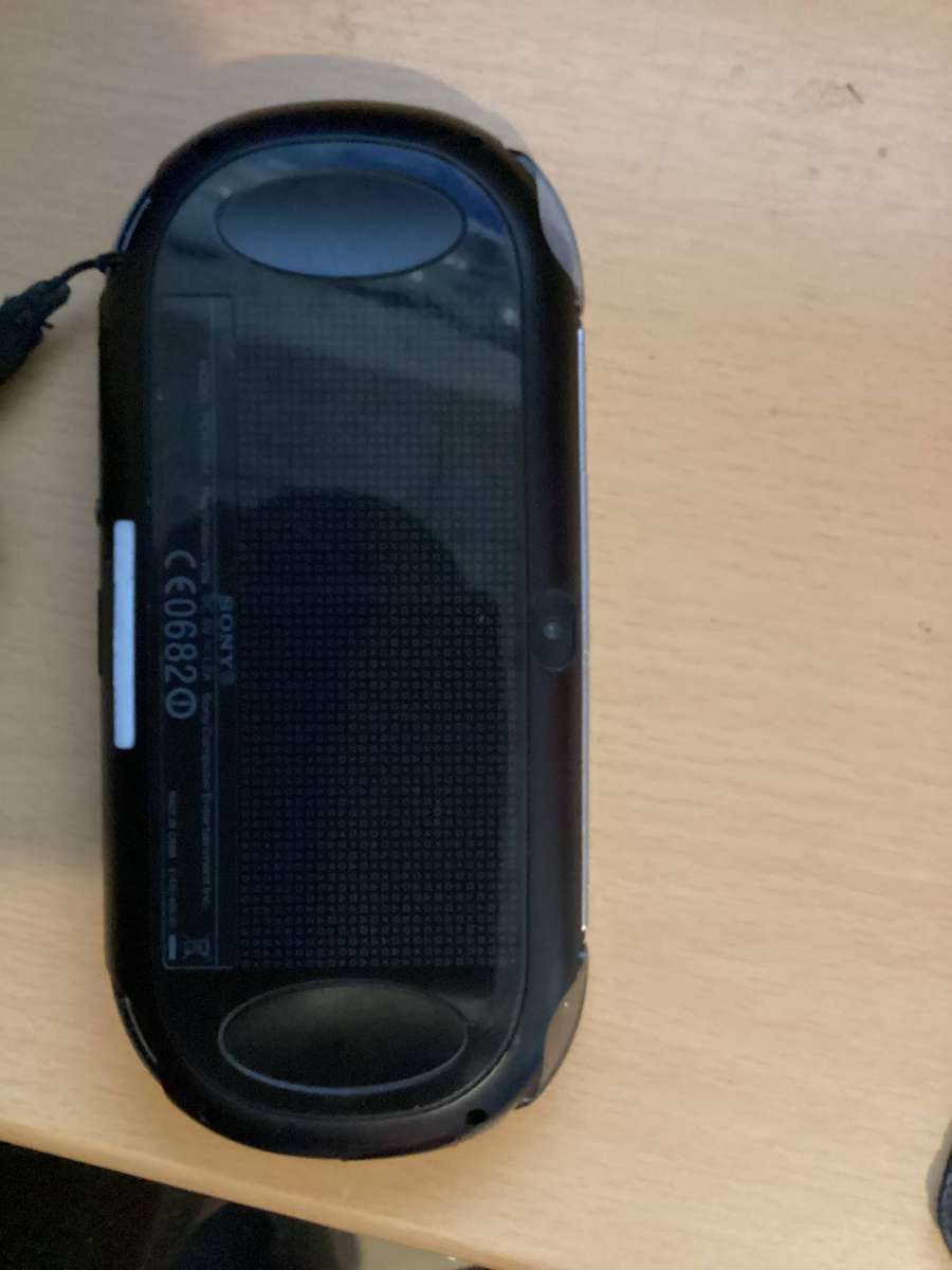 PSP Vita E0682 comes with a 240 gig memory card Modded with over 50games installed