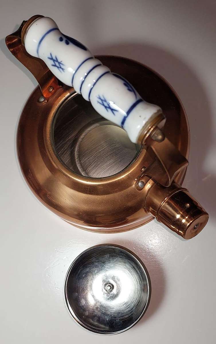 Copper kettle with nickel lining, whistle, porcelain handle and knob.