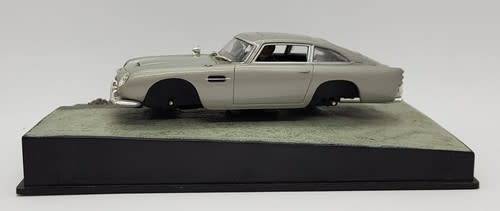 Aston Martin DB5 - Goldfinger model car  - casing cracked, broken mirror and missing light