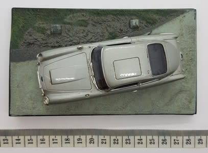 Aston Martin DB5 - Goldfinger model car  - casing cracked, broken mirror and missing light