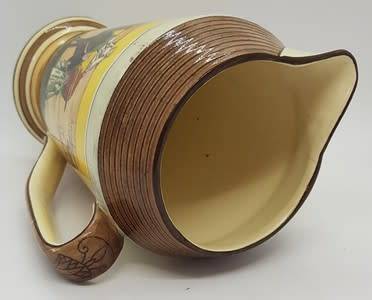 Royal Doulton `Desert scene` jug with hairline crack - as per photo