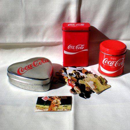 A collection of 3 miniature advertising  COCA - COLA tins. Vintage & collectable.