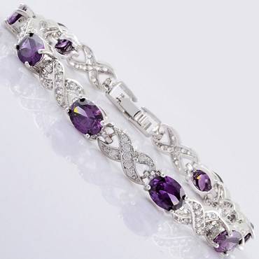 **STUNNING OVAL CUT PURPLE AMETHYST BRACELET SET IN WHITE GOLD**