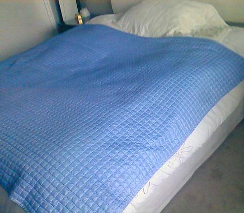 Pair of pale blue quilted bedspeads / comforters for single beds