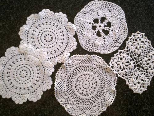 Lot of five white cotton doilies