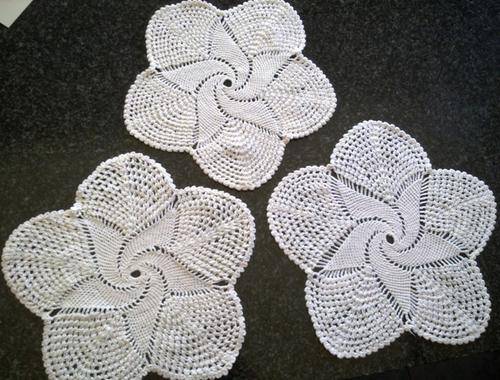Three pretty cotton pinwheel crochet doilies