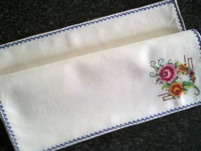 Beautiful set of eight embroidered linen dinner serviettes