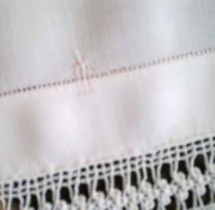 Striking antique white linen centre piece