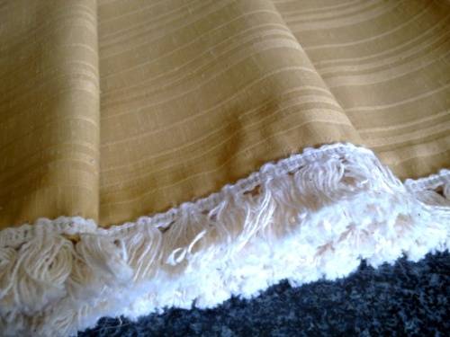 Large gold tablecloth with tassel trim