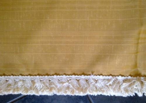 Large gold tablecloth with tassel trim