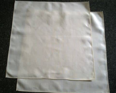 Pair of ivory Irish linen dinner serviettes