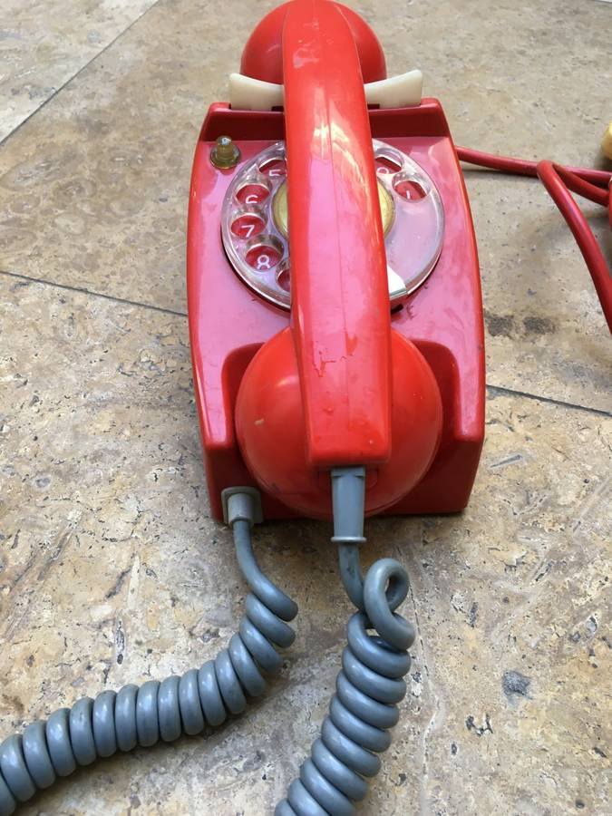 vintage red retro rotary dial up telephone