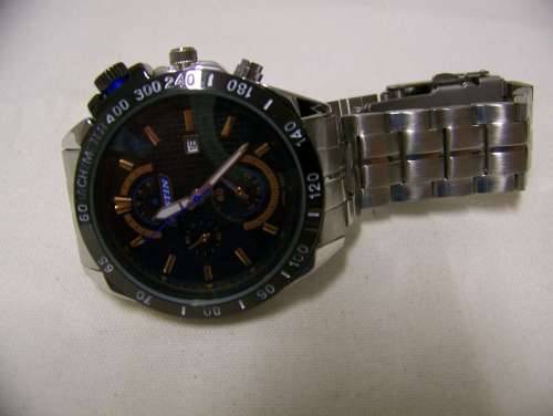 Justin. Black and copper face silver strap.