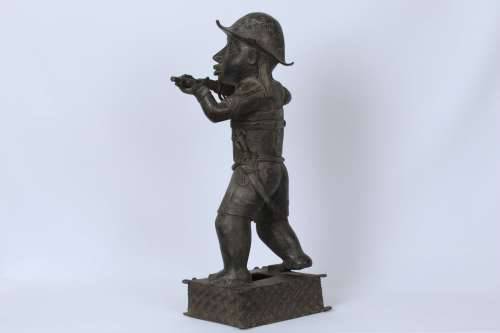 Brass figure of a Portuguese soldier holding a musket - Benin Nigeria