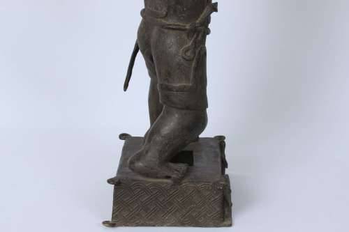 Brass figure of a Portuguese soldier holding a musket - Benin Nigeria