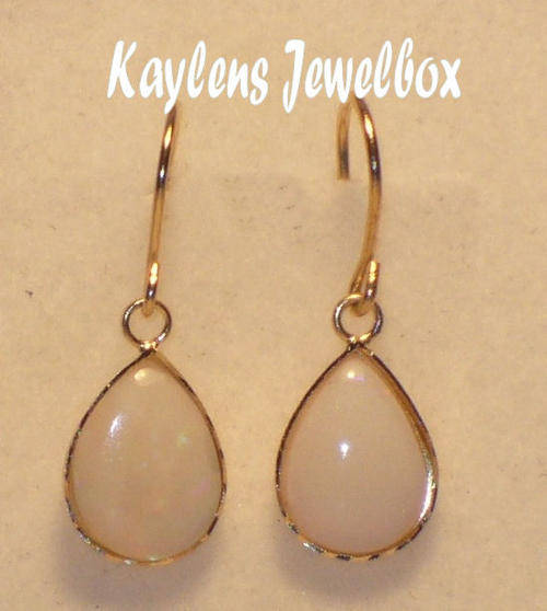 CLASSICAL, EXQUISITE:  9ct gold pear-shaped opal dropper earrings