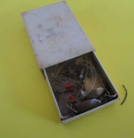 A lot vintage fishing tackle stuff in a very old "Black Magic" tin