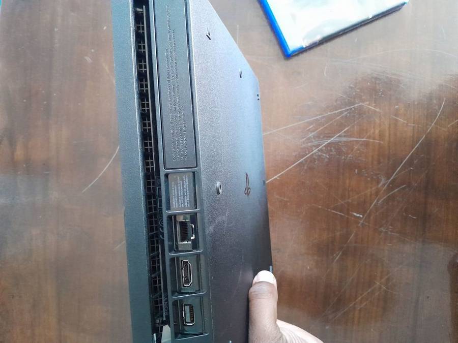 Pre owned ps4 SLIM with 2 games and cooling fan with charging port